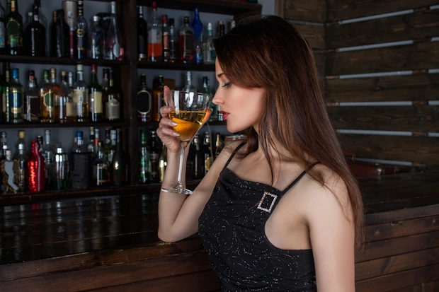 Woman drinking alcohol