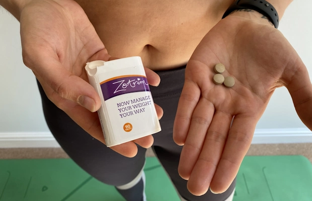 woman with zotrim pills