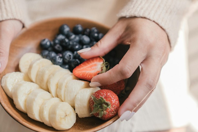 Bowl with babanas and berries