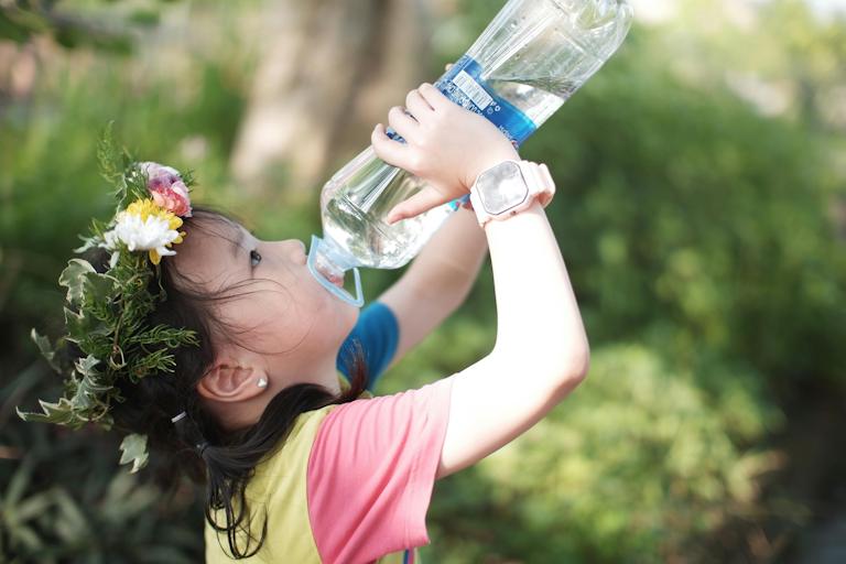 Little girl drinking water